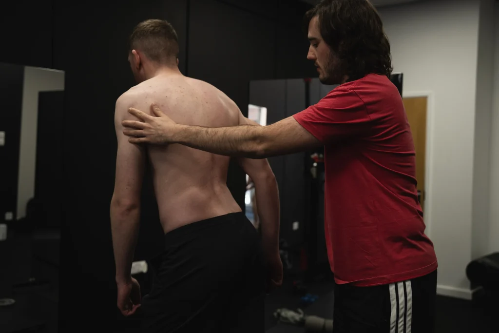 Bristol Biomechanics therapist assessing patient posture during movement therapy session