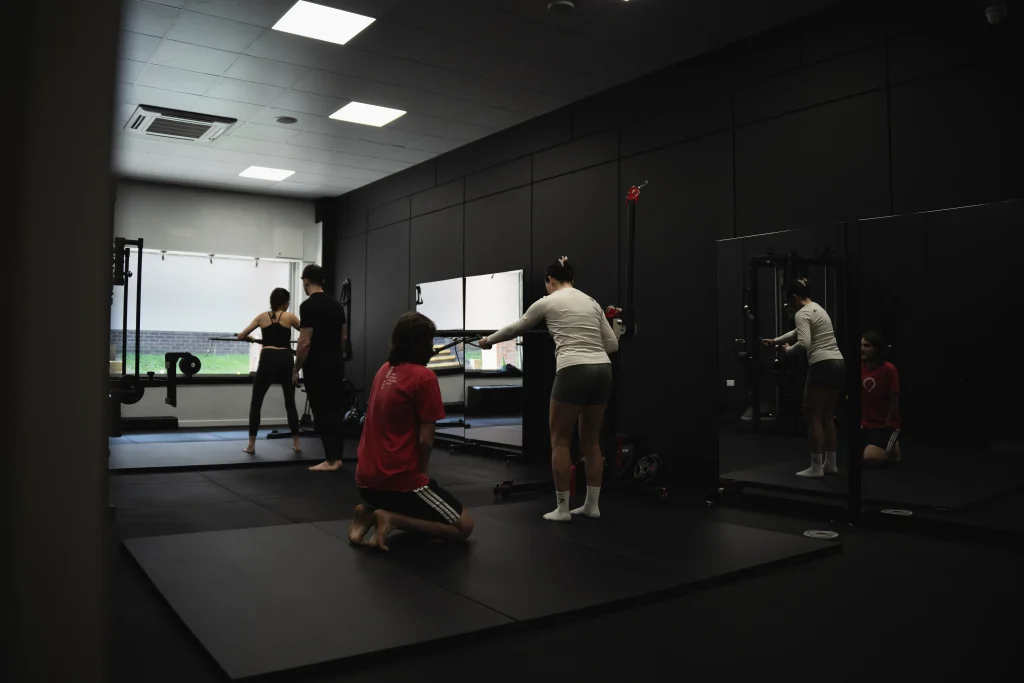 Functional Patterns trainers coaching clients on movement correction at Bristol studio