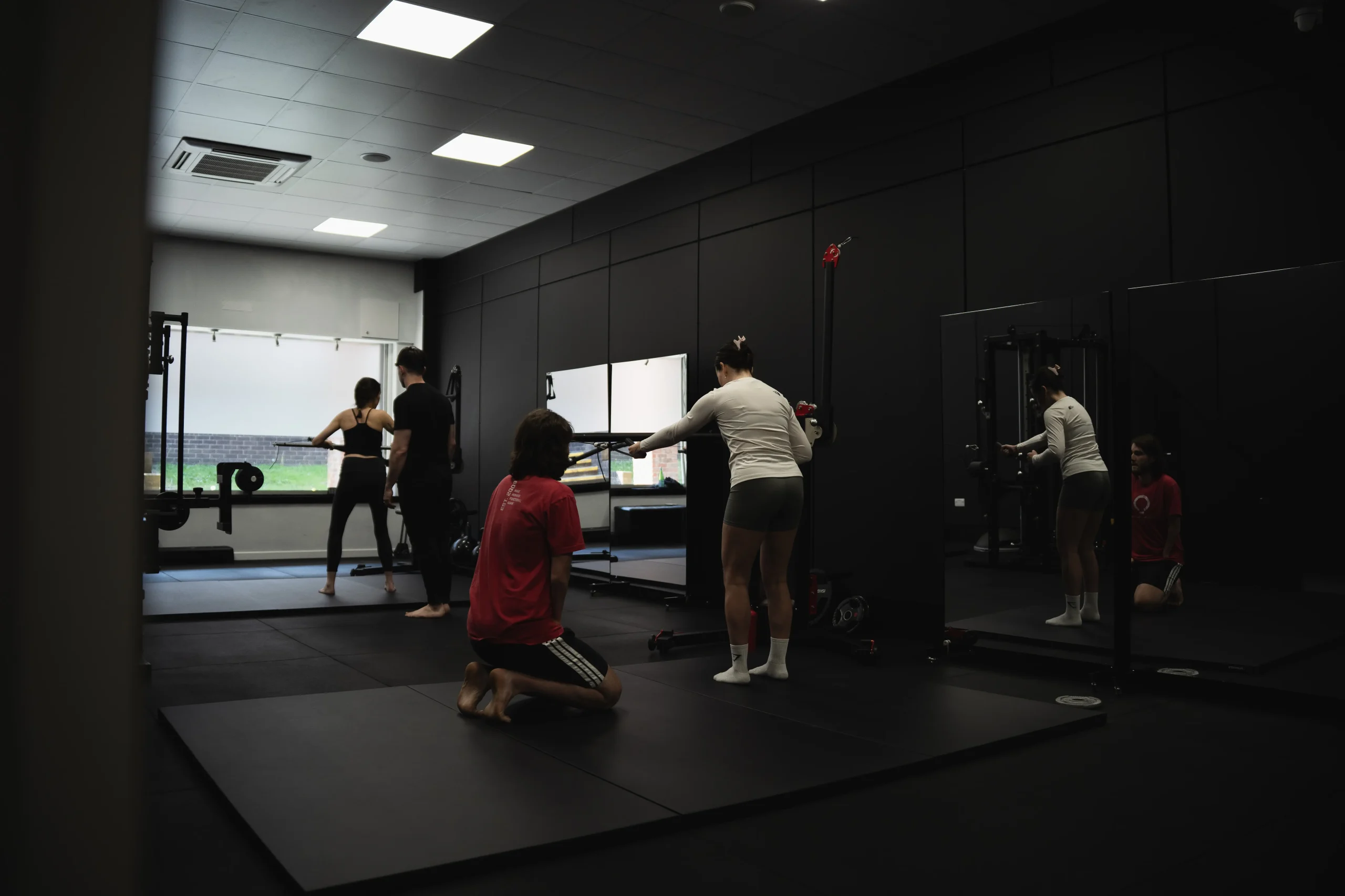 Functional Patterns trainers coaching clients on movement correction at Bristol studio