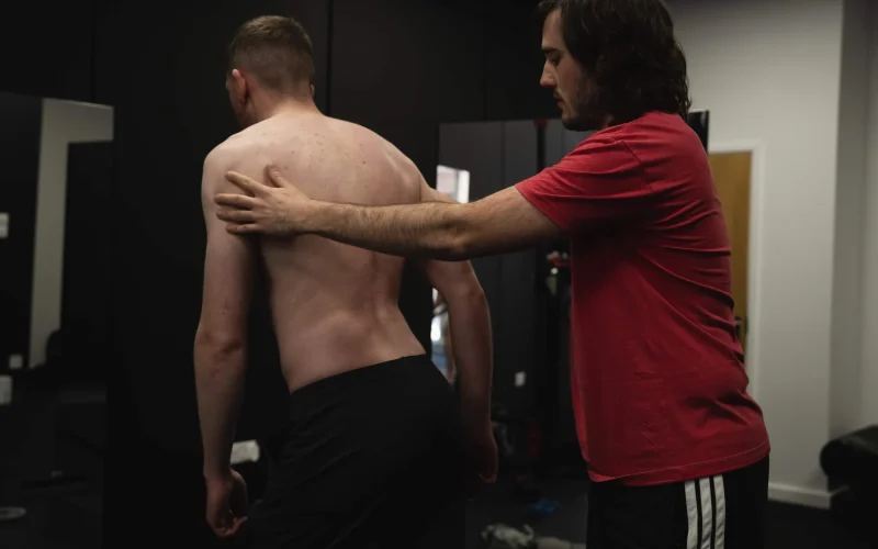 A client performing a Functional Patterns cable resistance exercise at Bristol Biomechanics